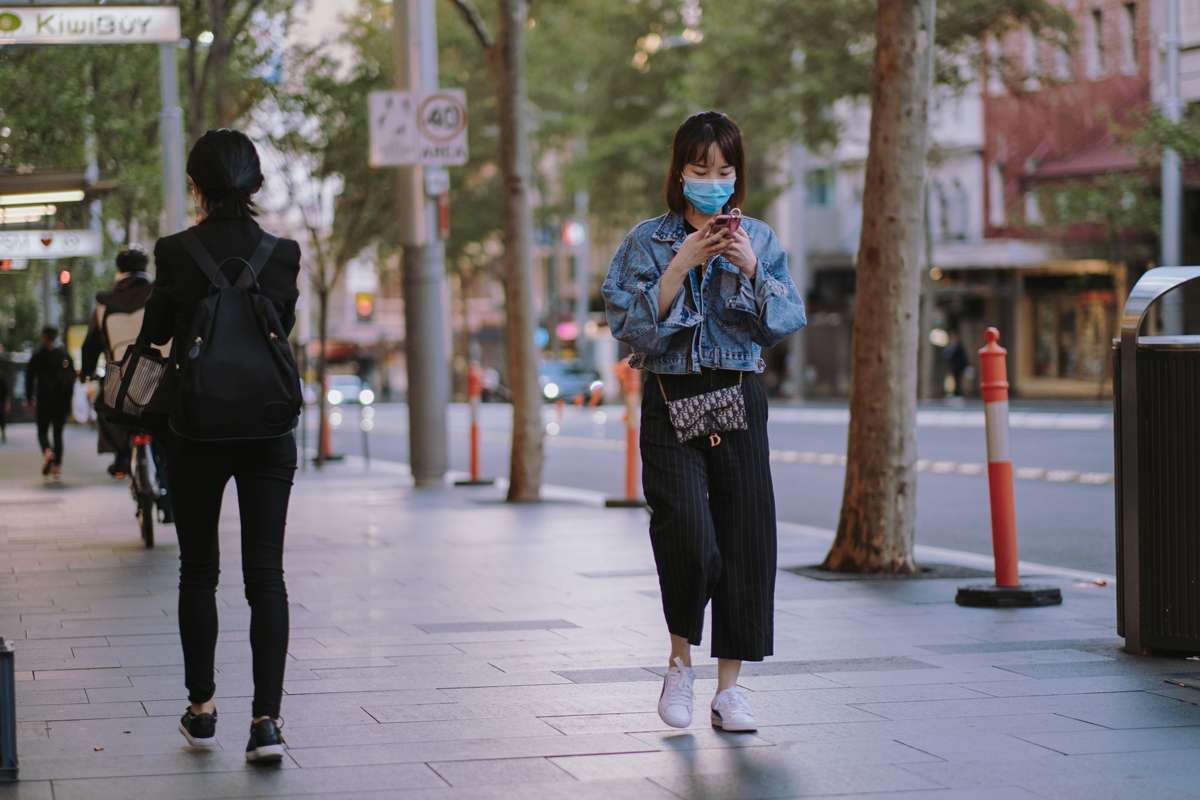 Covid19-Girl_Walking_Mask_Mobile